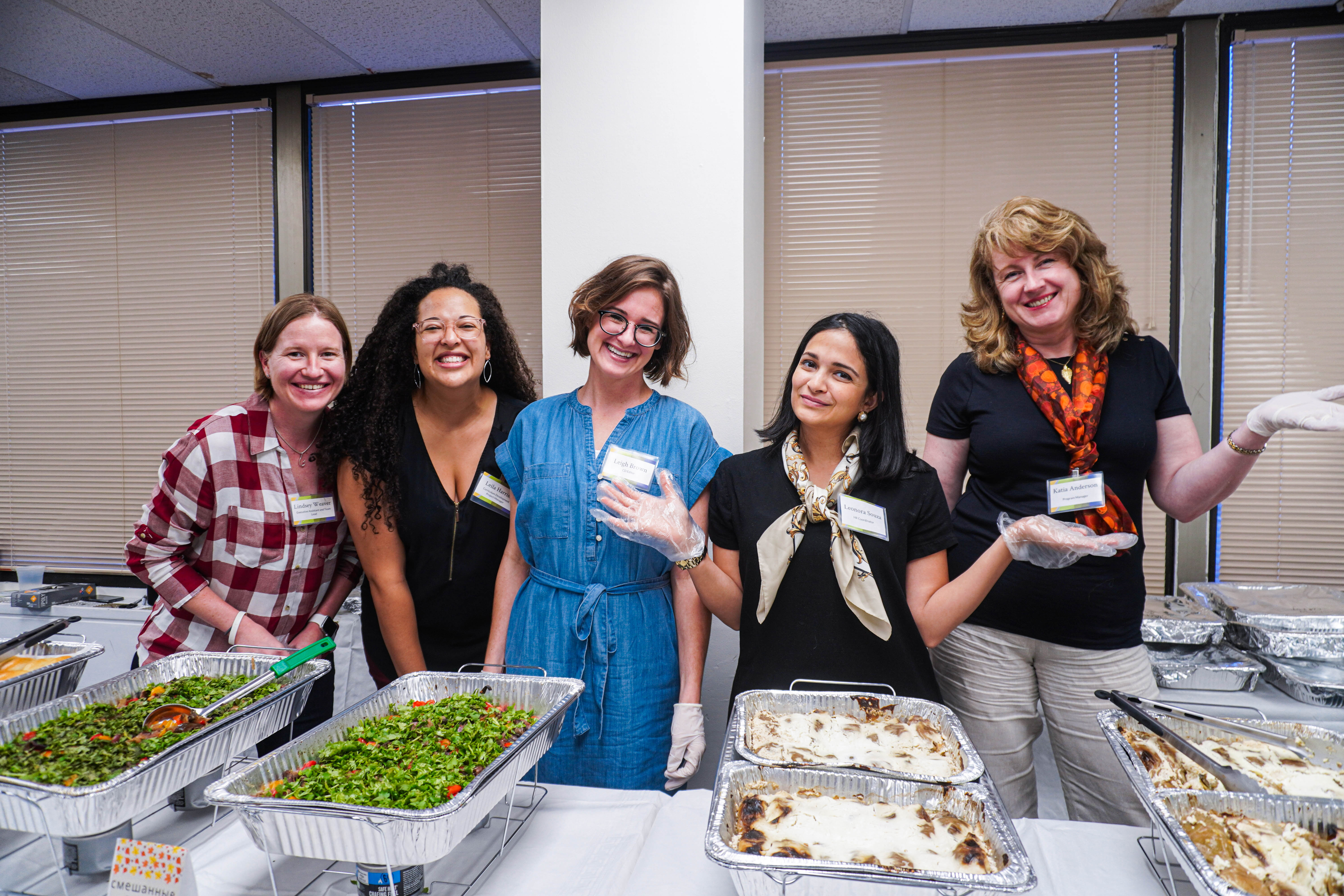 Diplomatic Language Services staff members serve traditional Russian food at the DLS 2019 Harvest Festival