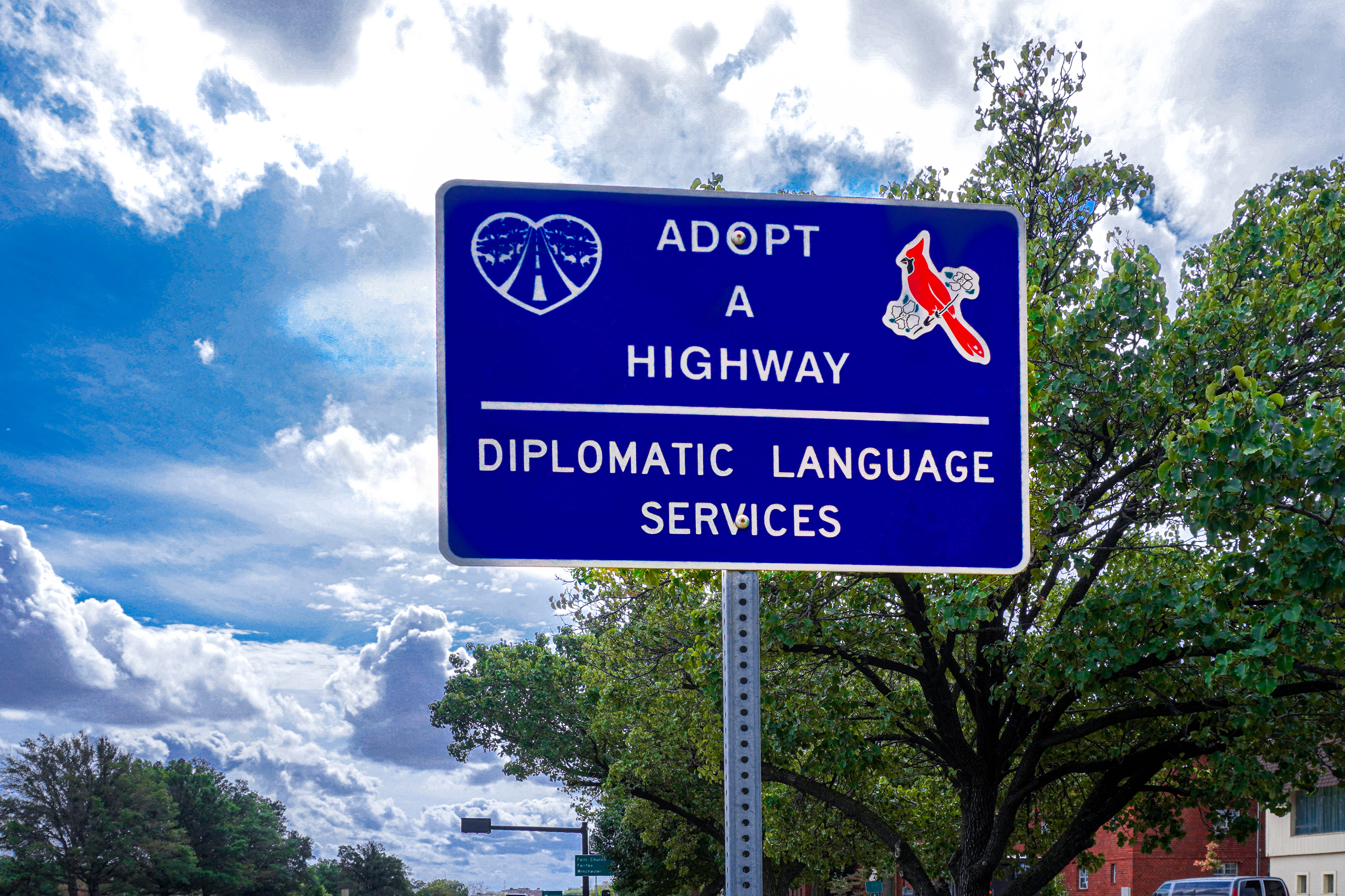 Diplomatic Language Services adopt-a-highway sign