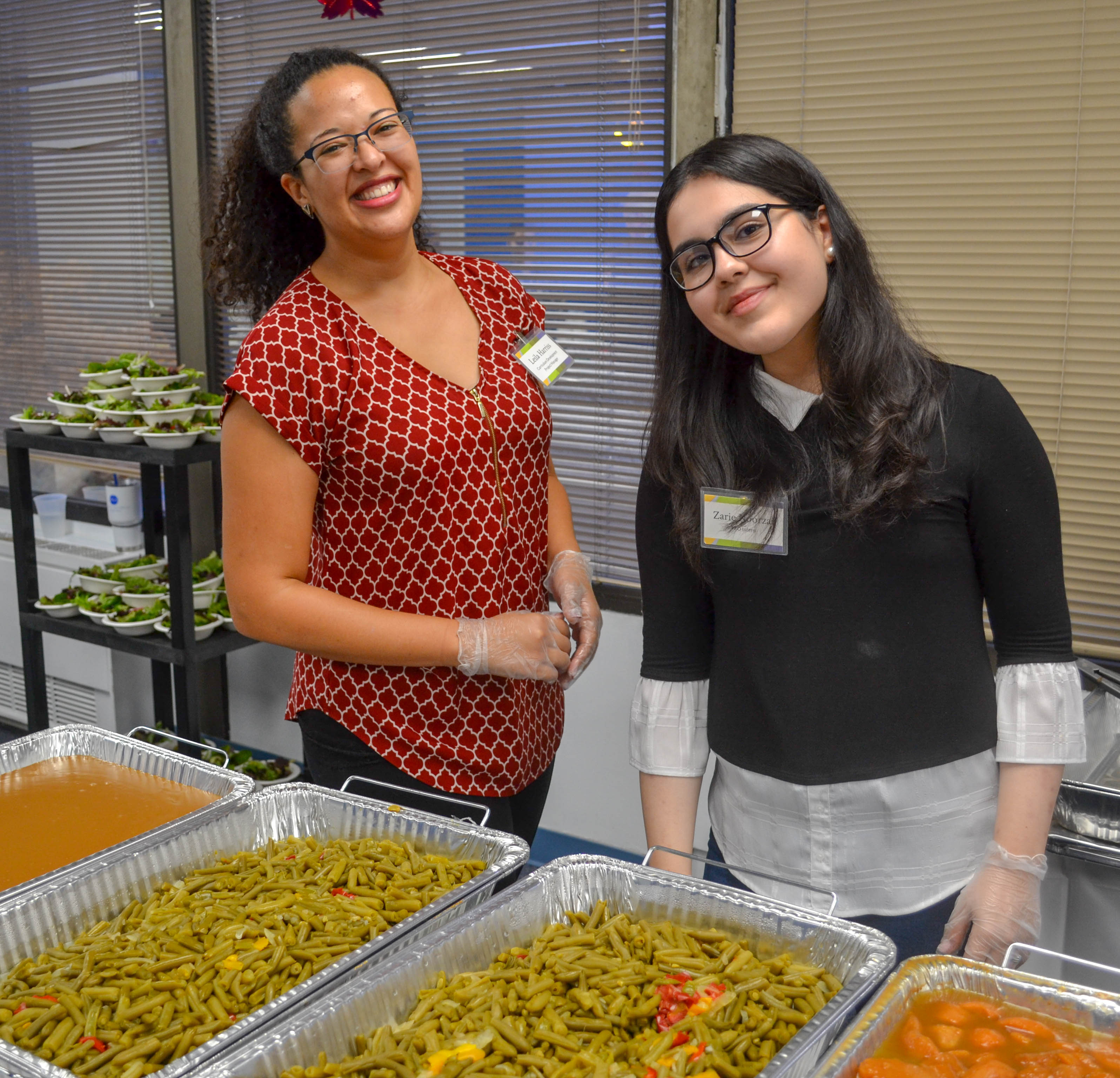 DLS staff members serve a Thanksgiving meal at our 2018 celebration