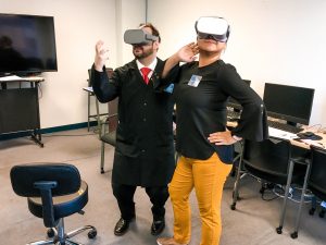 Diplomatic Language Services staff members in Virtual Reality equipment at Tenth Annual Open House